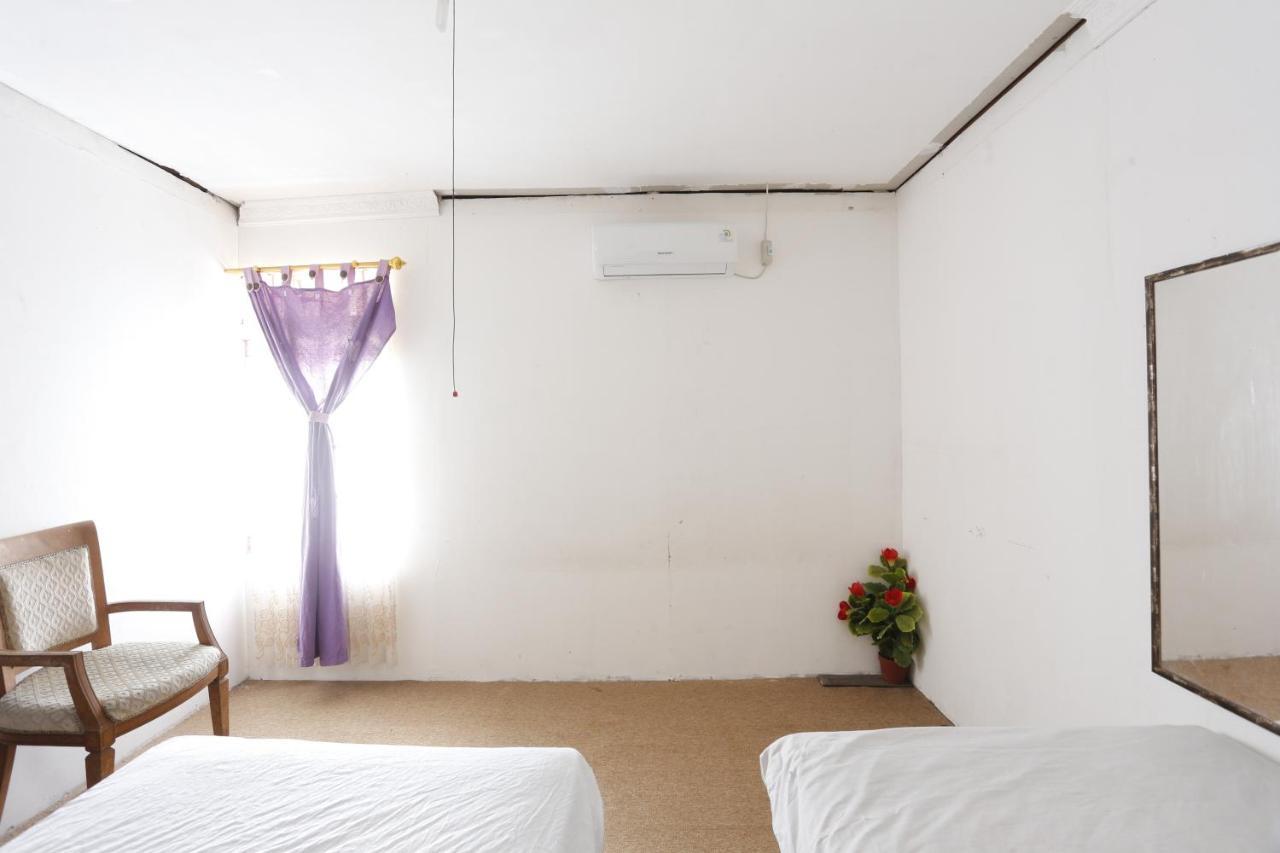 Oyo 93380 Penginapan Mangkoe Barokah Tanah Grogot Buitenkant foto