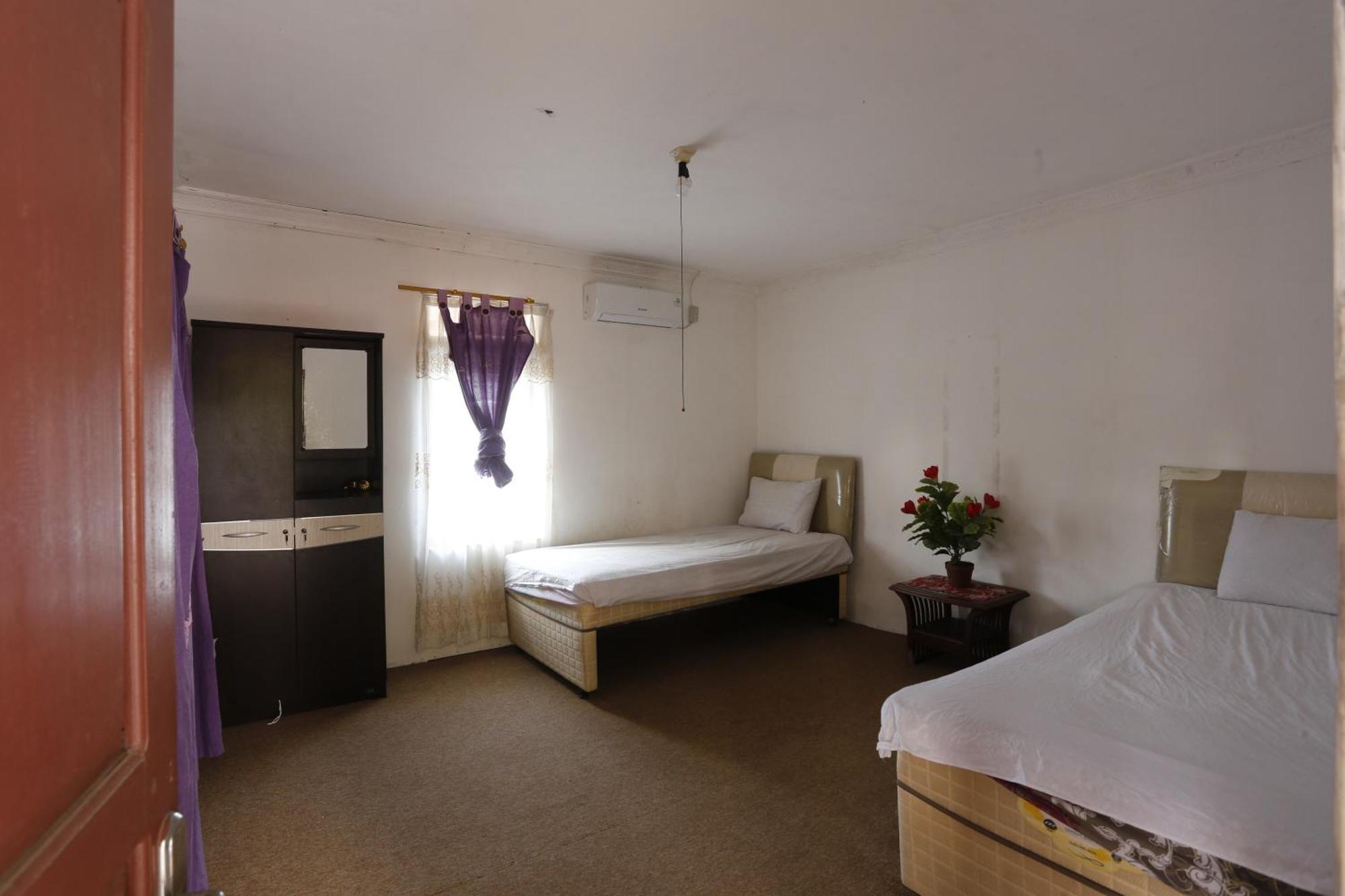 Oyo 93380 Penginapan Mangkoe Barokah Tanah Grogot Buitenkant foto